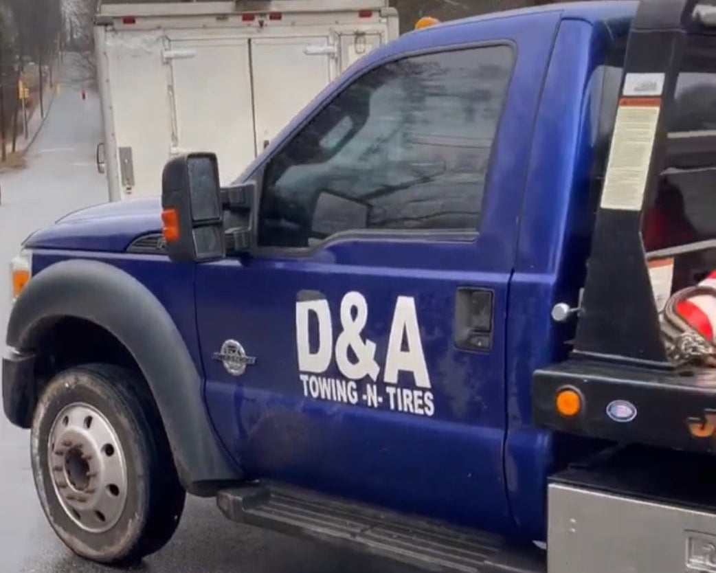 DNA Roadside & Towing - Reliable towing service for quick and safe vehicle recovery, Driver side of tow truck.